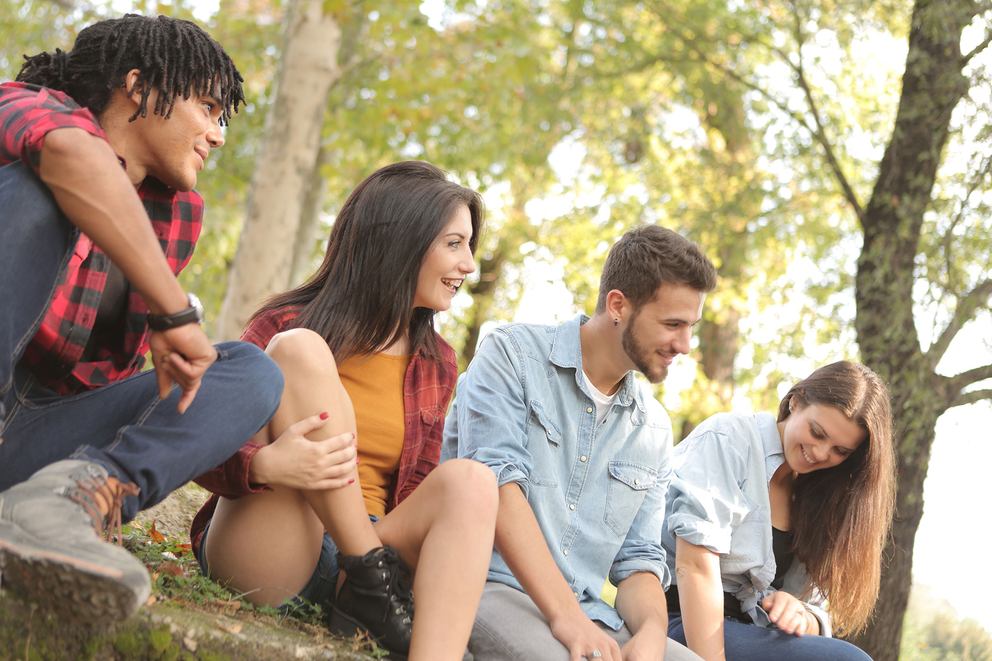 People sharing a conversation outdoors